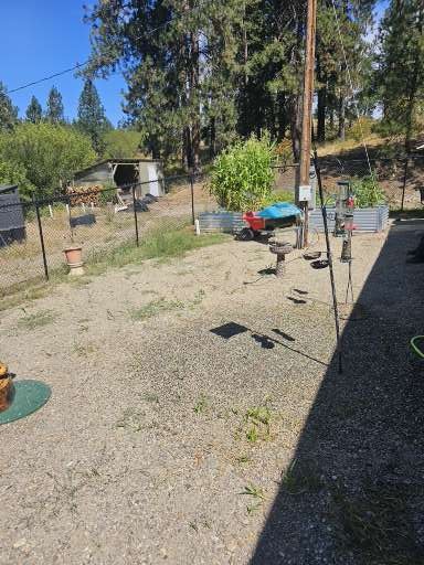 Before Backyard Grade Change, Patio & Retaining Wall Transformation in Elk, WA